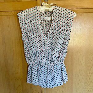 Sleeveless pleated blouse in double polka dot print